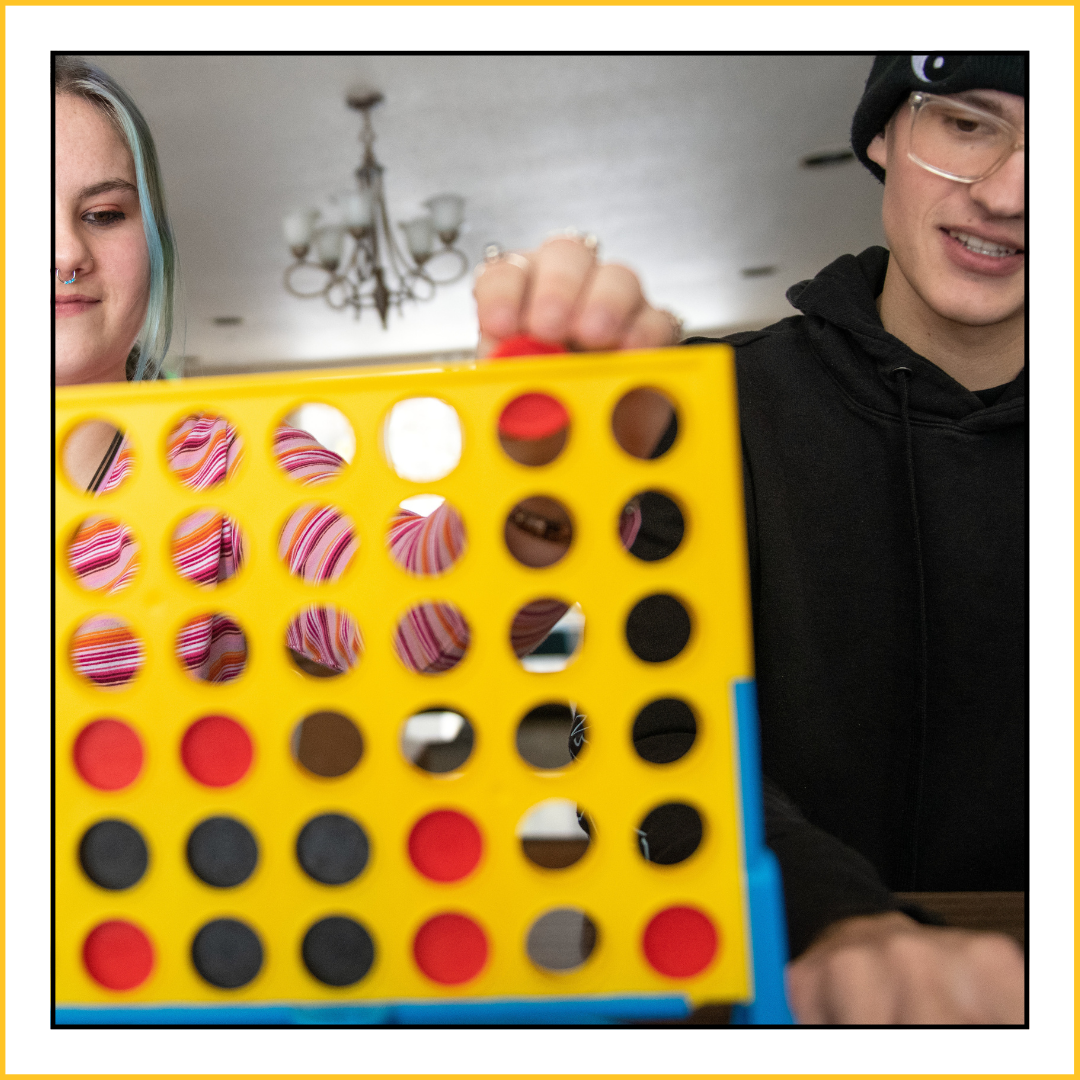 students playing connect four in tobin house