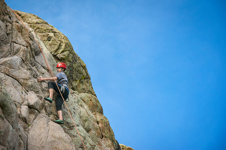 A climber climbs a rock at Vedauwoo