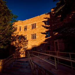 A UW building on campus during a sunset.