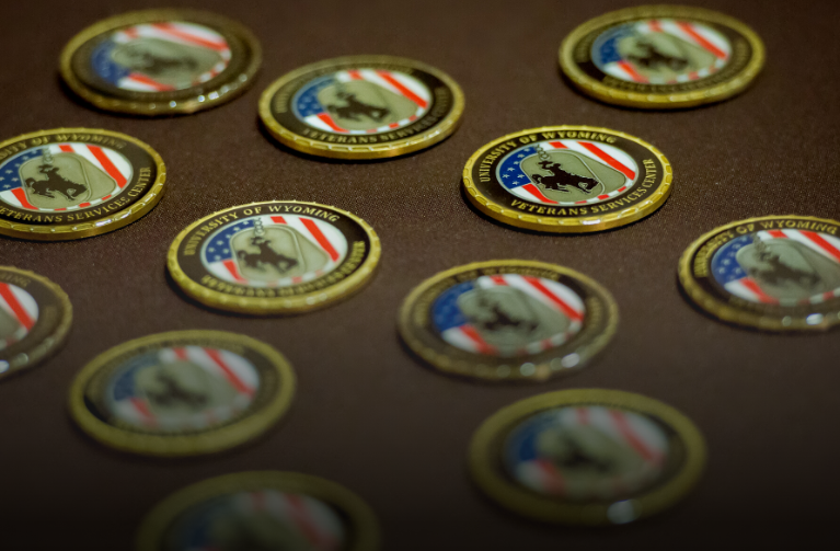 Veteran Services Center coins laid out on a table